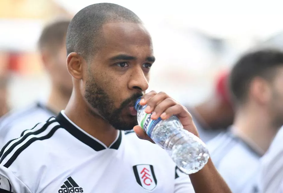 male-football-player-drinking-buxton-water.jpg